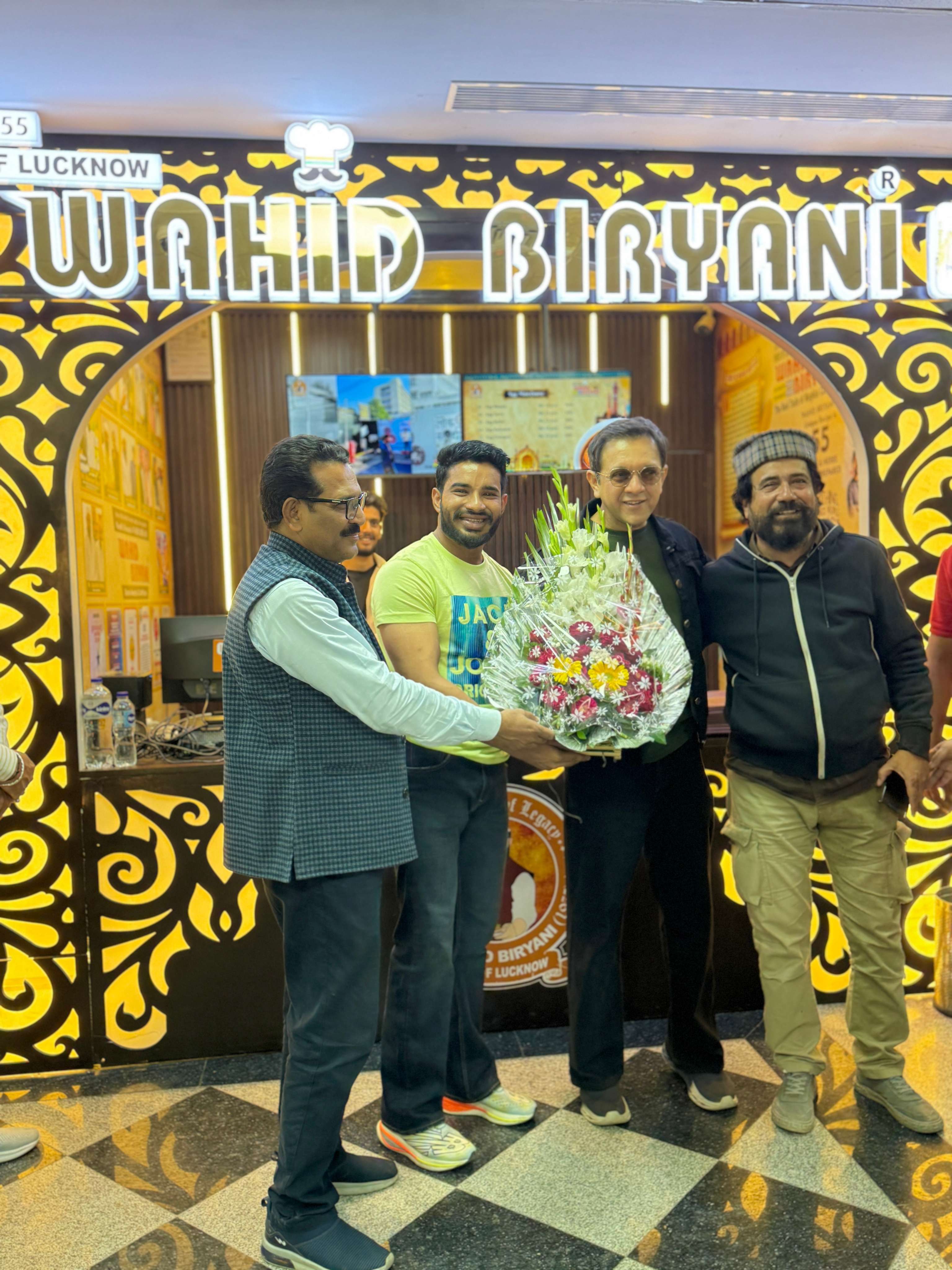 Group celebration in front of the Wahid Biryani outlet